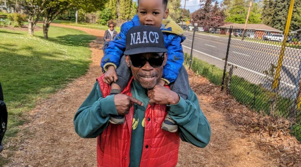Zahar riding on James Posey's shoulders