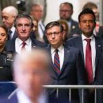 Trump cronies standing together led by Mike Johnson