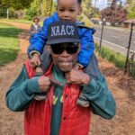 Zahar riding on James Posey's shoulders